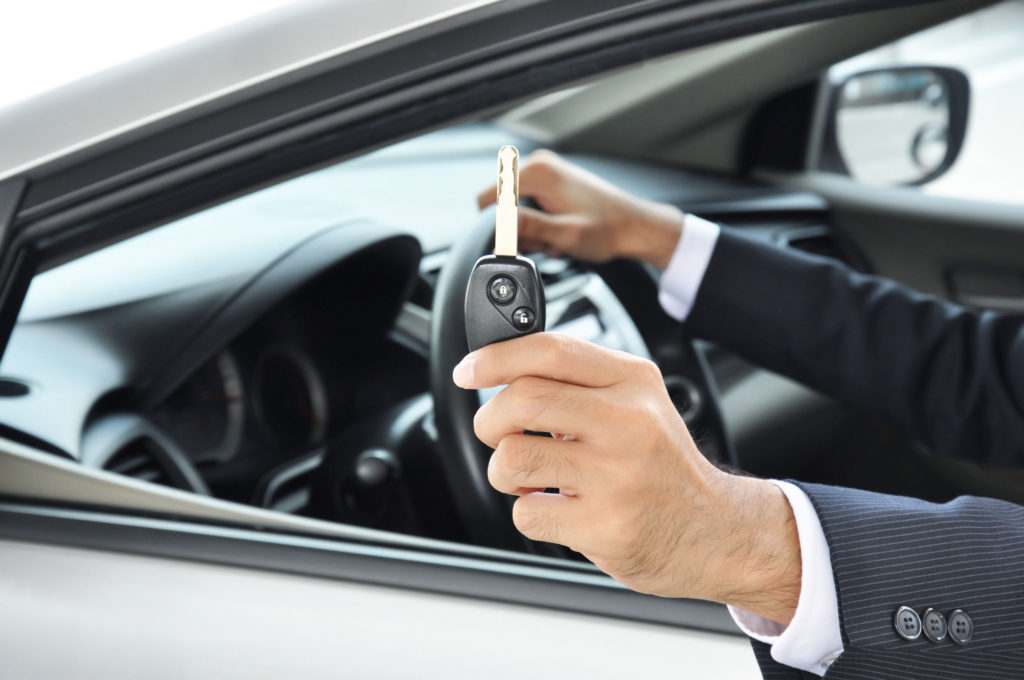 hand holding car key